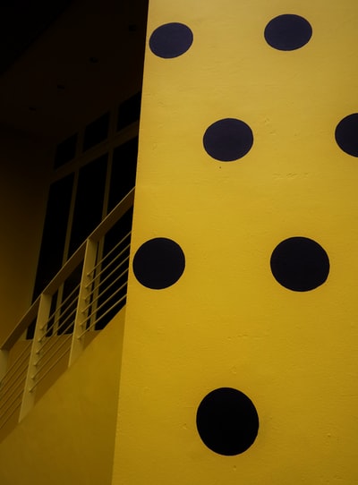 yellow and black round wall decor